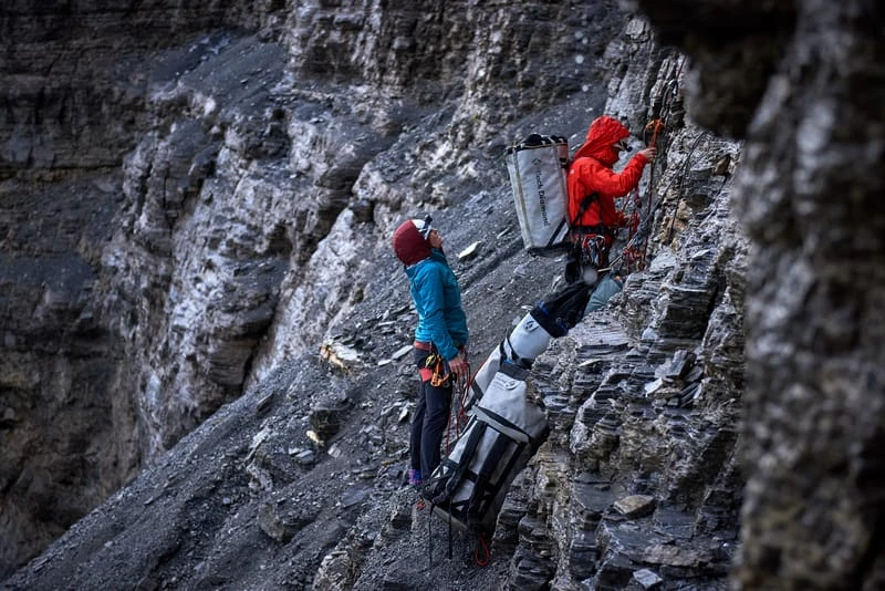 Jacopo Larcher and Babsi Zanger dealing with a lot of gear during a thunderstorm on Eiger Nordwand. I was there to document the first single-push repetition of the hardest route in the wall. ©Paolo Sartori